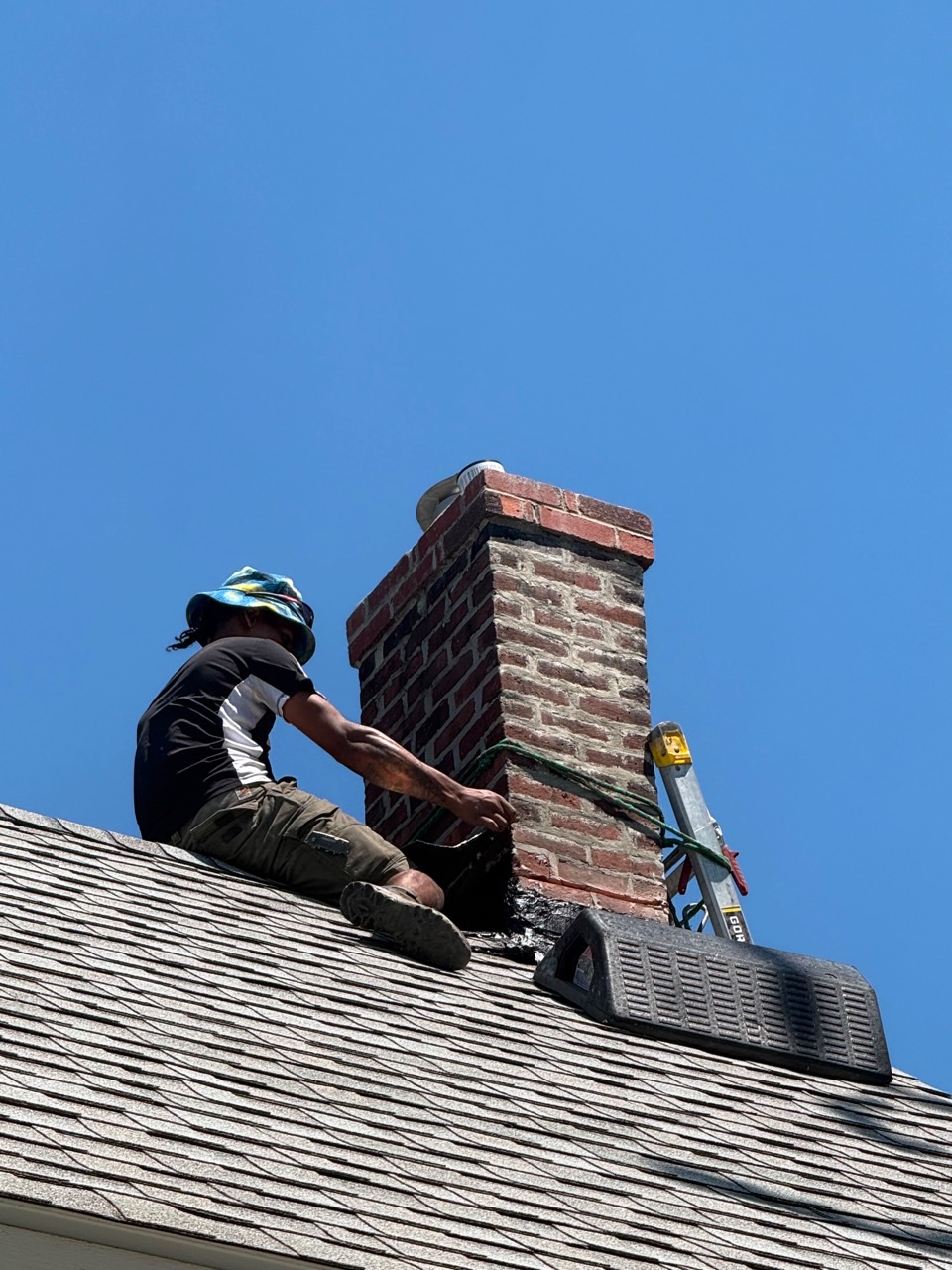 Technician performing chimney repointing in Braintree MA