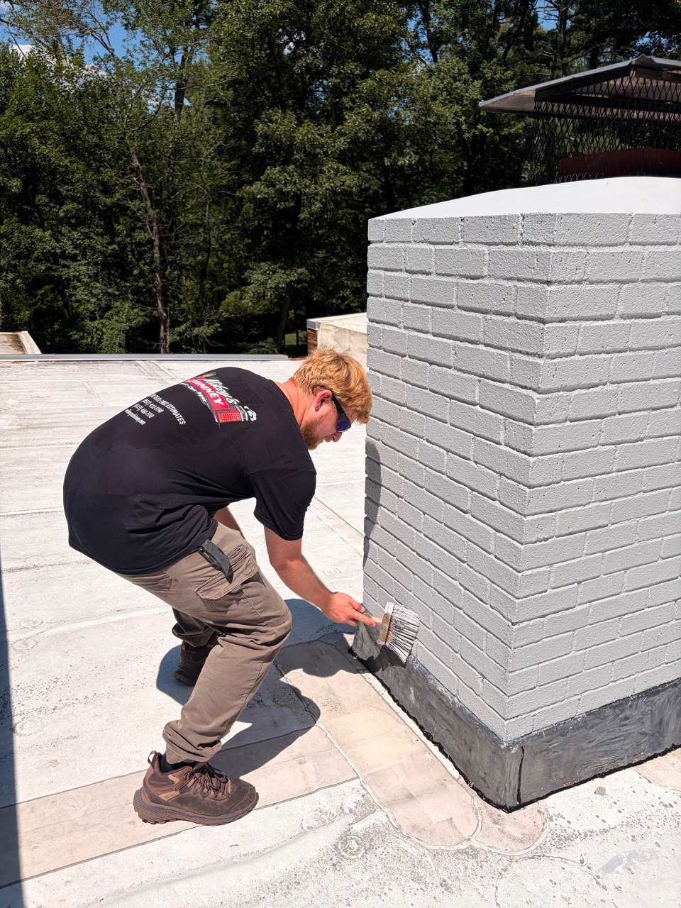 Painting the lower chimney masonry in Wayland MA
