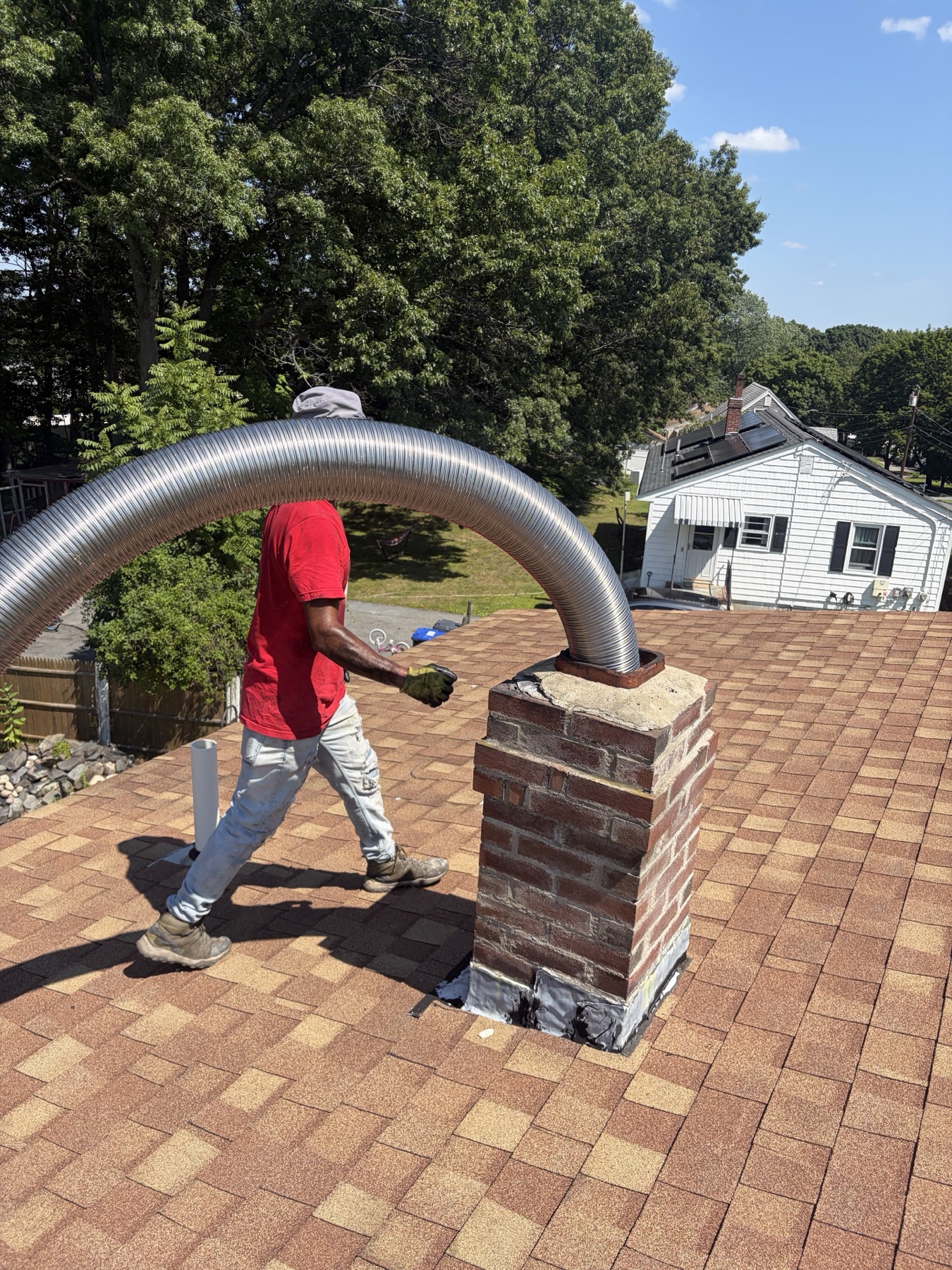 Flexible chimney liner being installed in Methuen MA